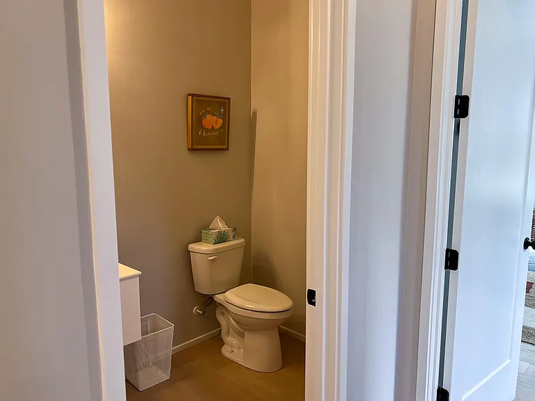 Hall half bathroom right outside of master bedrooms for rooftop guests