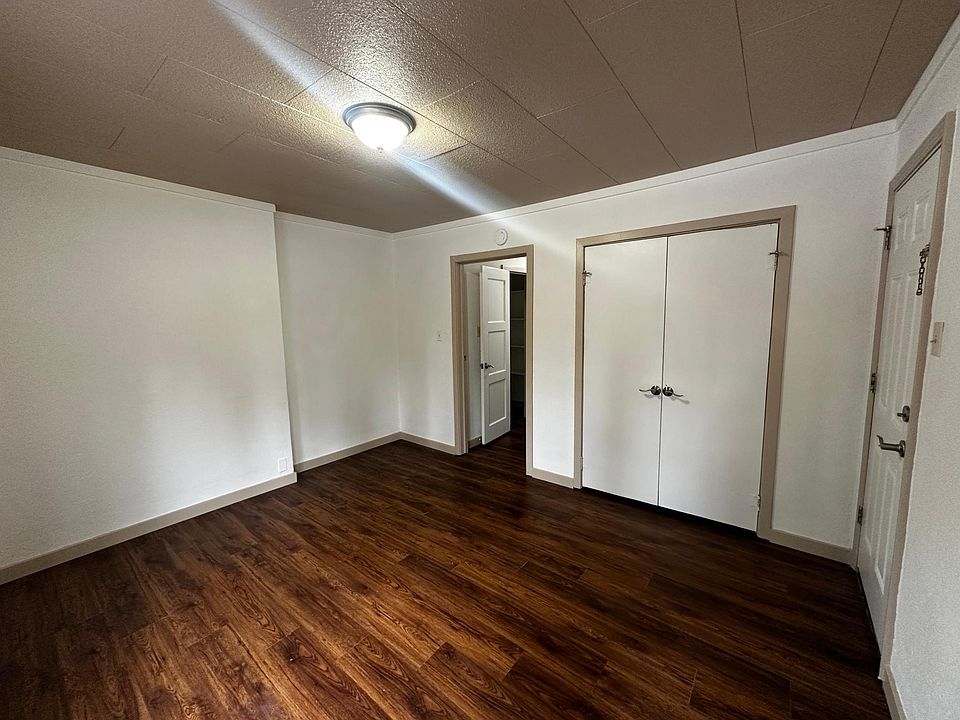 Side door access to the private side yard and covered porch