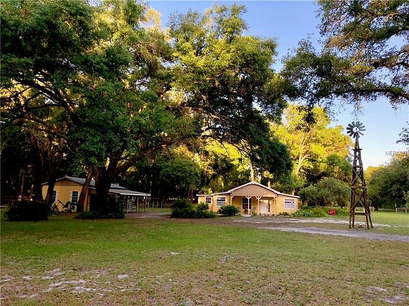 Updated inside and Outside Curb Appeal. The home has a new roof, and the property is fenced and cross fenced. Petite and well designed for the Equestrian,  Part Time or Full Time!! MINUTES to the Ocala National Forest on Horseback