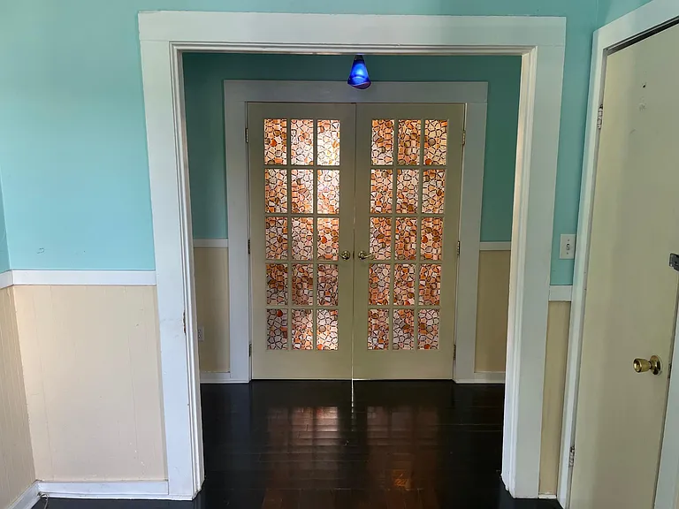 Optional bedroom / den / dining room through the french doors. Right off of living room / foyer.