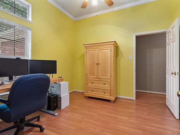 Study is bright and cheery with great natural light, crown molding and ceiling fan. Excellent room to use as a school room or craft room, too.