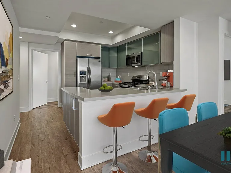 Kitchen with Countertop Bar, and Stainless-Steel Appliances
