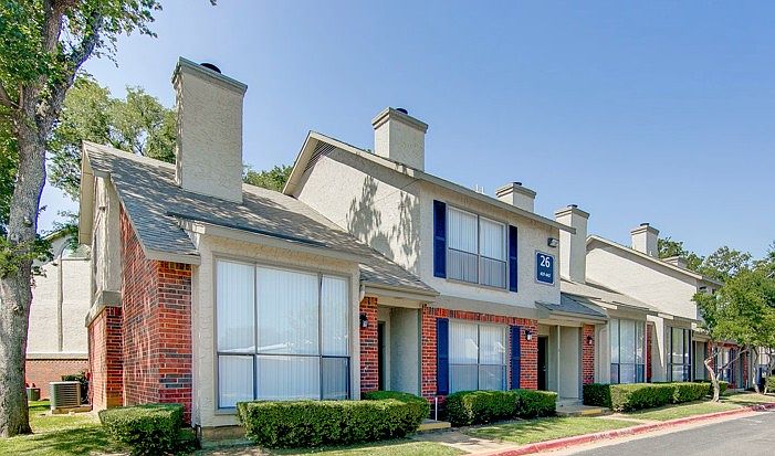Beautiful exterior view of Three60 North Apartments with updated architectural design and mature landscaping.