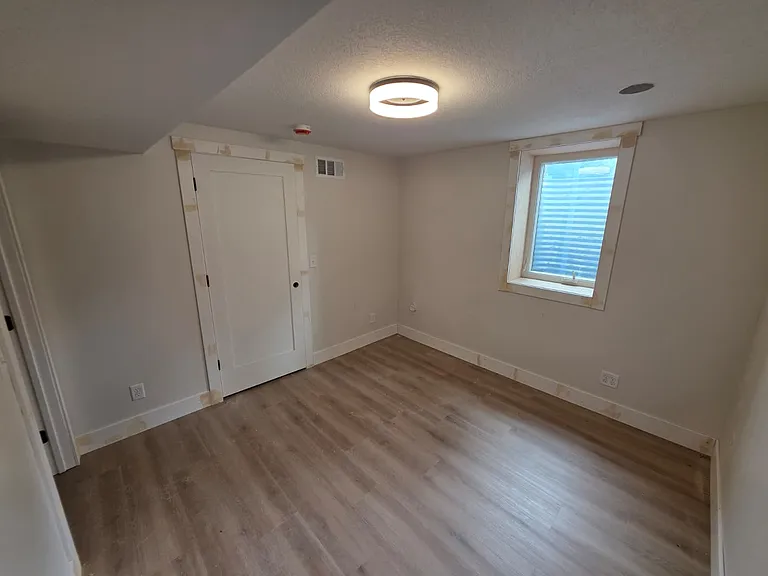 Lower-level bedroom 3 with oversized walk-in closet. New Anderson window.