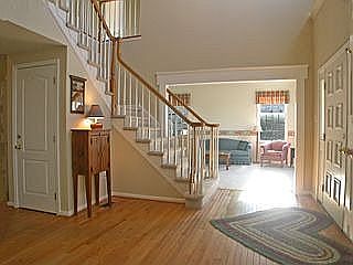 Expansive 2-Story Foyer with Turned Staircase