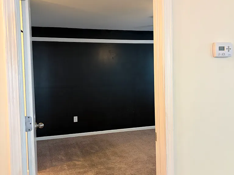 View of master bedroom from kitchen island