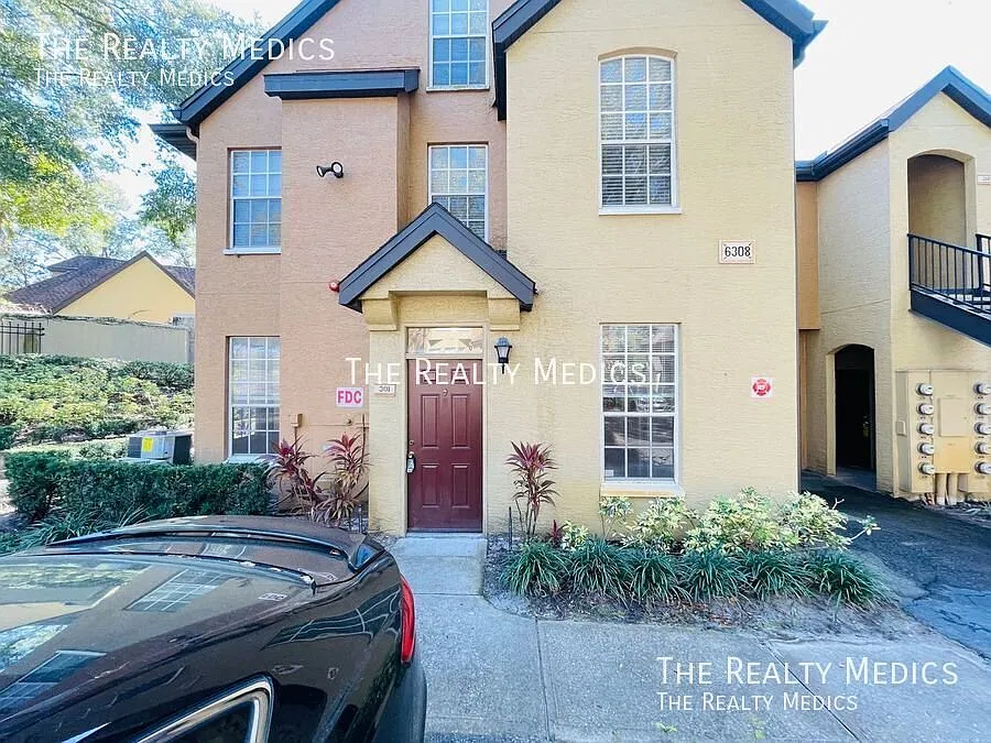 Updated 1-Bedroom Condo in Gated MetroWest Community | Private Garage + Assigned Parking — Photo 1