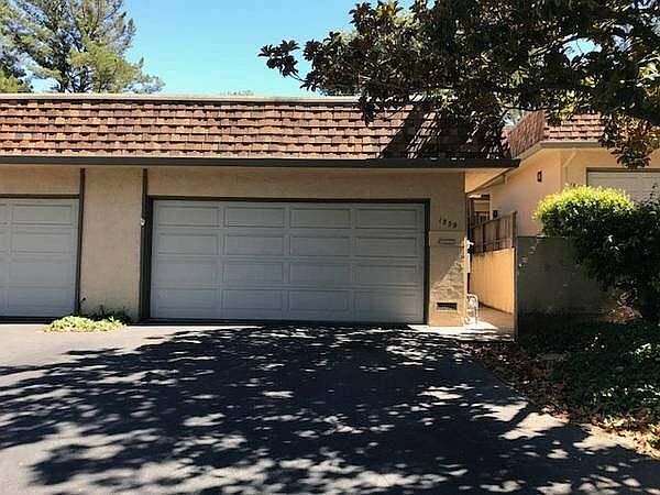 Front of unit with attached 2 car garage
