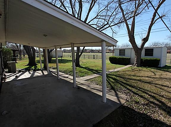 Covered patio with storage shed