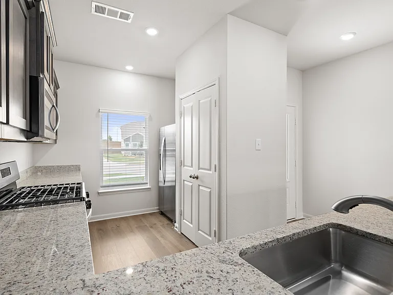 The kitchen has a pantry that is perfect for storing food and other kitchen essentials.