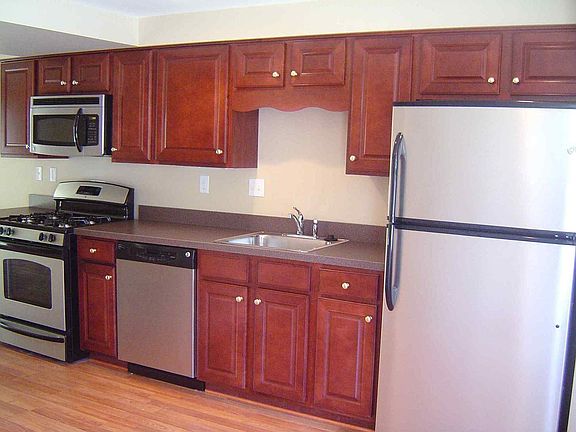 Cherry Cabinets with Stainless Steel Appliances