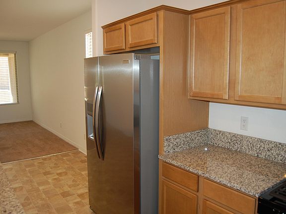 Kitchen with refrigerator.