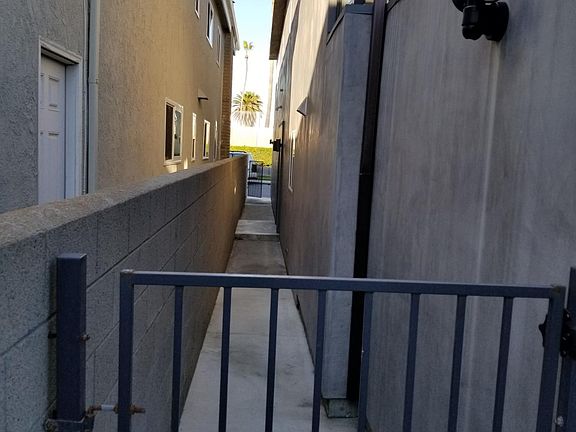 This view is looking towards Seashore Drive from the alley....half way up on the right you'll find the front door.