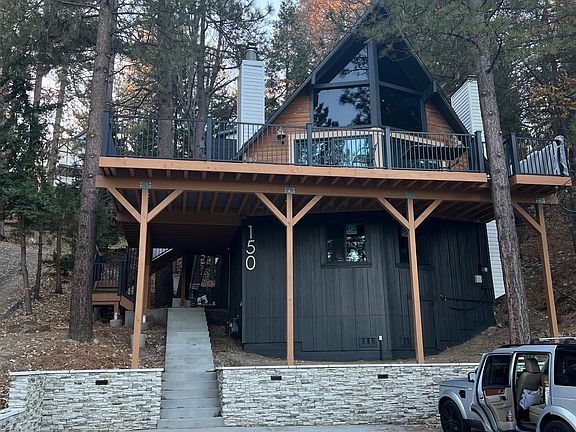 Front of home with large parking area