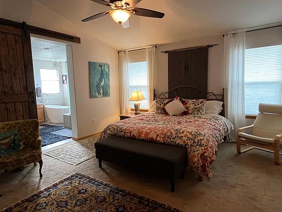 Master bedroom with newly remodeled master bath