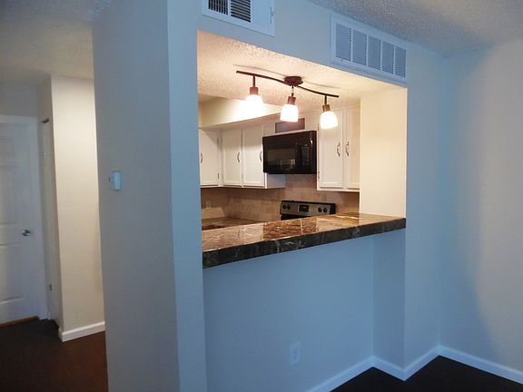 Kitchen opens to living area