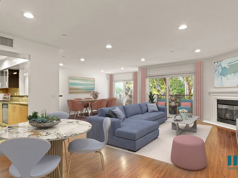 Kitchen, Breakfast Nook, Dining Room, and Living Room with Balcony