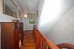 Upper Landing..fine banister, wide board floors