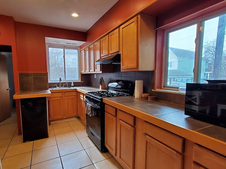 Spacious Kitchen includes dishwasher, new stove, and microwave