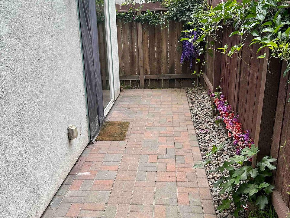 Entry paver patio. Sliding glass door with walk-through magnetic closing screen.