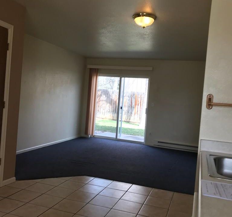 View living room from kitchen carpet tan in the available un