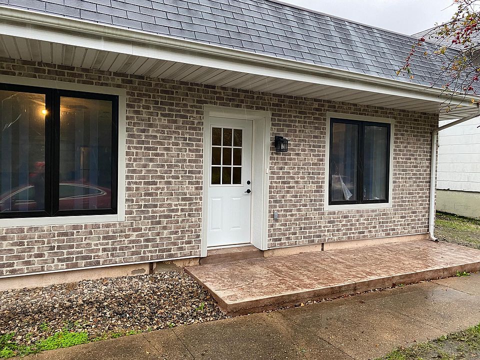 Front entrance with patio area (rail to be installed at occupancy)