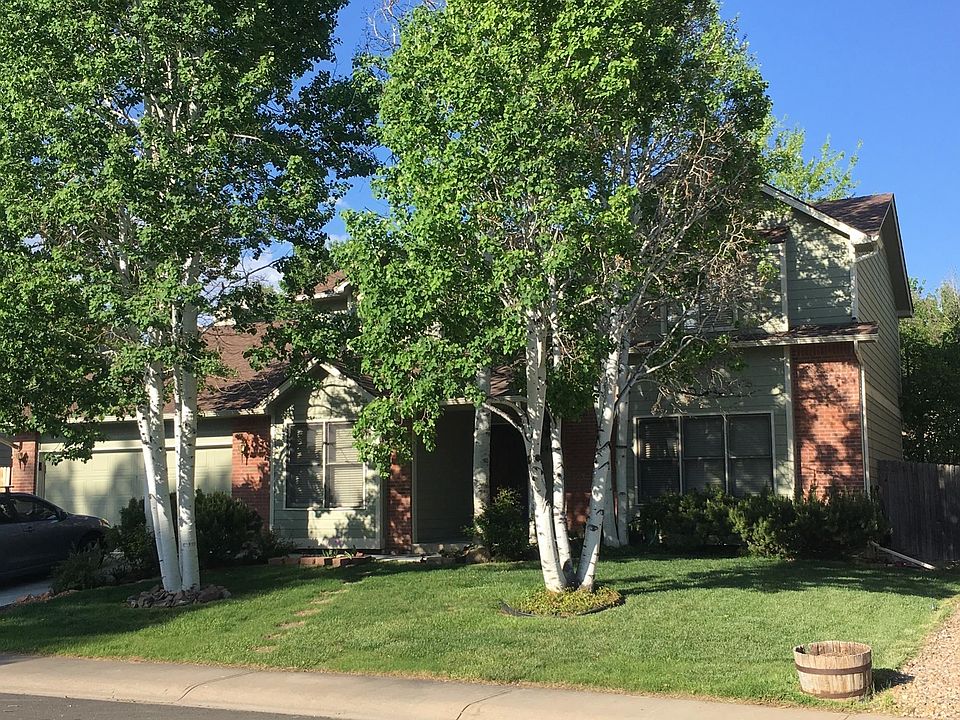 Mature trees and healthy grass add to curb appeal