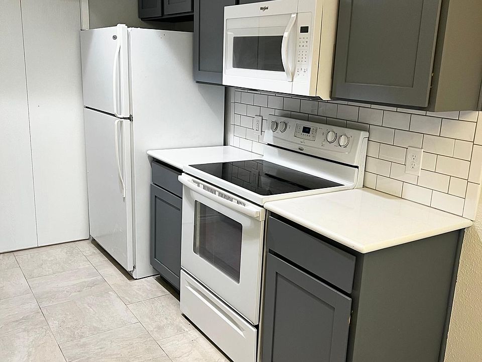 Quartz counters with subway tile backsplash.