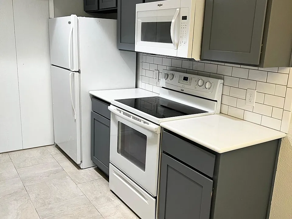 Quartz counters with subway tile backsplash.