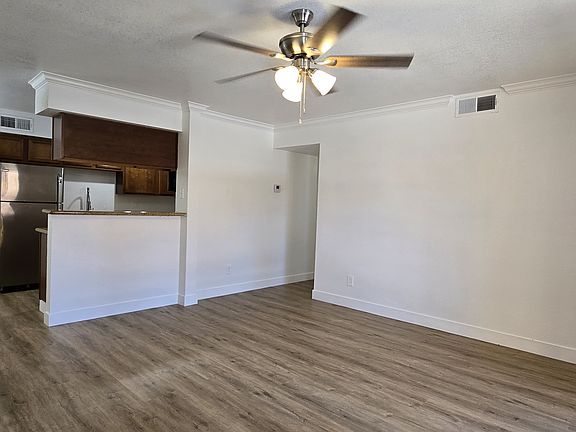 FRESHLY PAINTED CONDO HOME
NEW LVP FLOORING
WITH CROWN MOLDING IN THE LIVING ROOM WITH NATURAL LIGHT