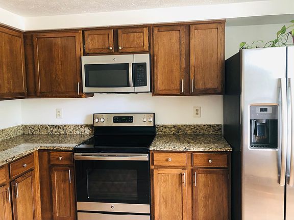 Kitchen with oven and microwave
