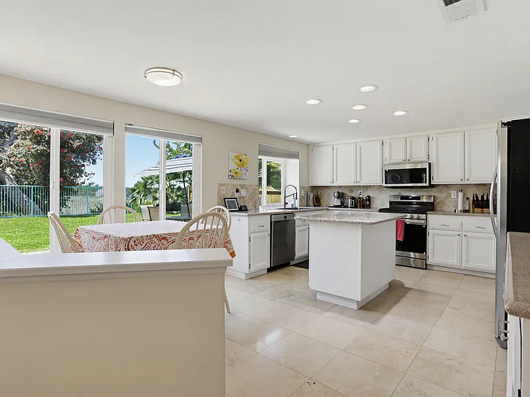 From family room viewing Breakfast Nook and Kitchen.