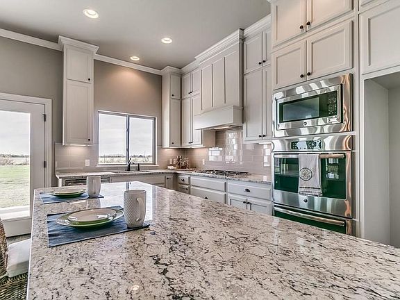 Open plan kitchen with all appliances