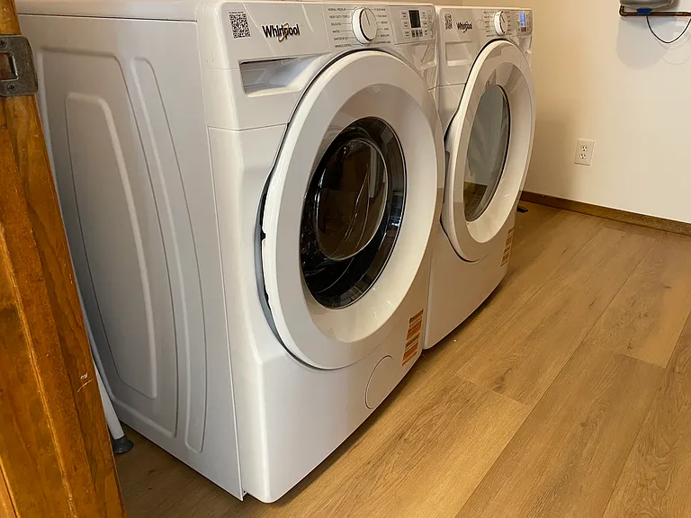 Laundry room with new Whirlpool washer and dryer