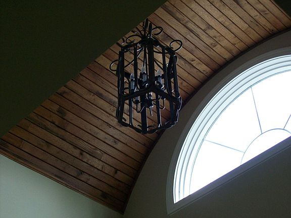Hand carved arched ceiling in foyer.