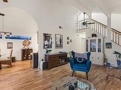 Main living area view to dining and stairs