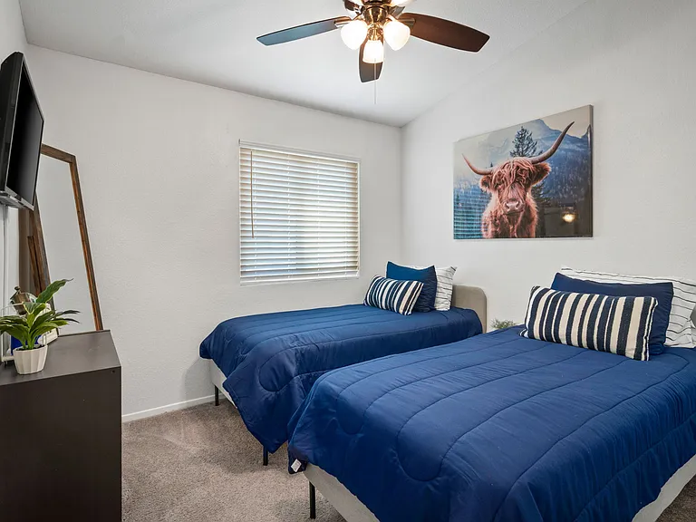 Bedroom 1, displays two twin beds