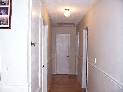 Hardwood flooring down the bedroom hallway.