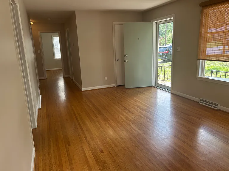 Large living area with lots of natural light. Wide hallway to 2/3 bedrooms & bath