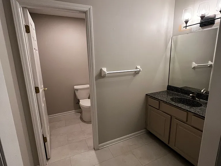 master bedroom with an en suite full bathroom