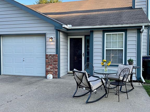 Wonderful sitting area next to flower garden