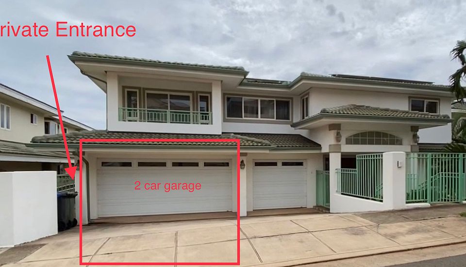 Spacious two car garage with parking on driveway for two cars. Private entrance to apartment on left