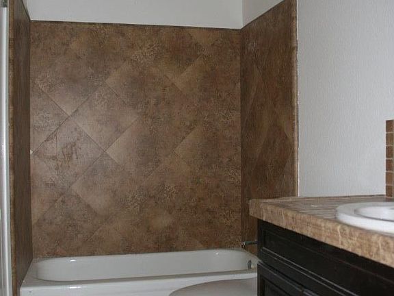 Bathroom has 2 access doors