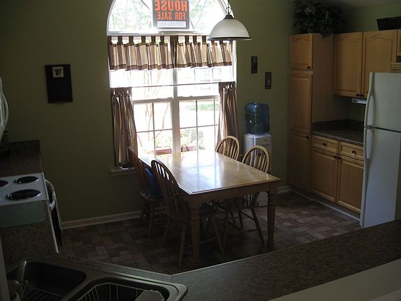 Eat-in kitchen, upgraded countertops, hardware, light and flooring.