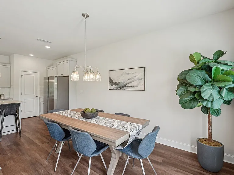 Charming dining area thoughtfully arranged for six guests.