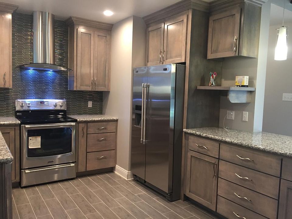 Kitchen-custom maple cabinets, granite counters, and Stainless Steel appliances.