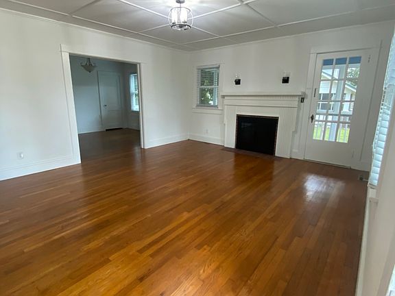 Living room, door leading to screened in porch beside fireplace!