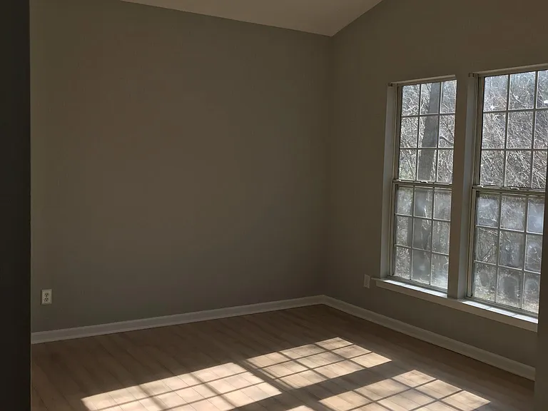 Bedroom. Sunlight, vaulted ceiling.