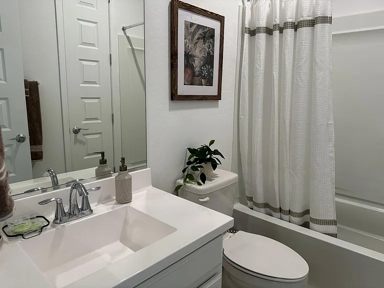 Secondary bathroom- with tub and shower combo.