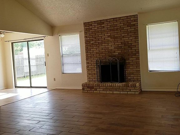 Den with eating area by patio door.